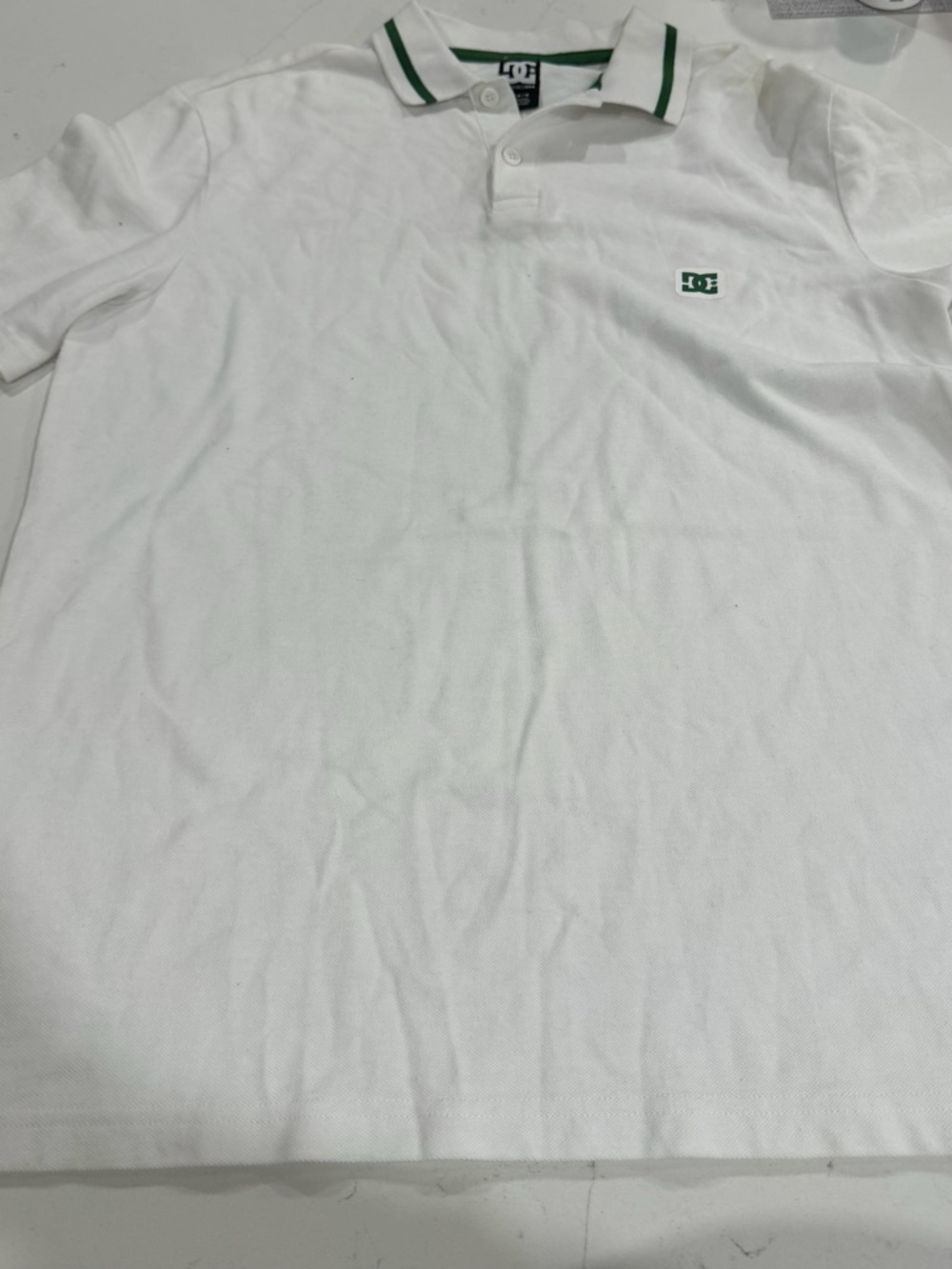 DC White Polo with Green Trim and Chest Logo - Size M